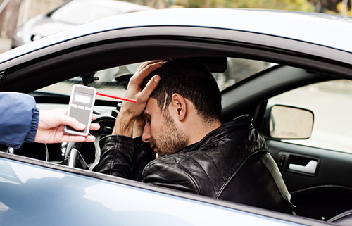 Police are checking the driver if he's under the influence while driving to charge with DUI (Driving Under the Influence) if proven guilty.